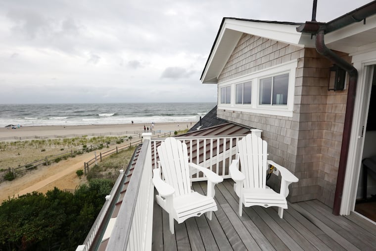 An ocean view from one of the decks at the home in Ocean City. The exterior is white cedar shake with unfinished copper for some of the roofing and gutters, whose colors will age and change over time.