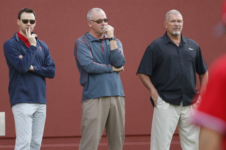 Phillies general manager Matt Klentak (left) and director of player development Joe Jordan (center) face a long-term absence from one of their top draft picks last summer.