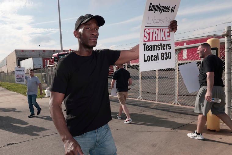 Teamsters Local 830 members picketing for better wages and benefits in front of Liberty Coca-Cola Beverages at G Street and Erie Avenue in Philadelphia on Sunday.