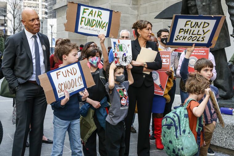 William Hite, then the superintendent of the Philadelphia School District, stands with kids during a 2022 school funding rally held by the Children First advocacy group outside City Hall.