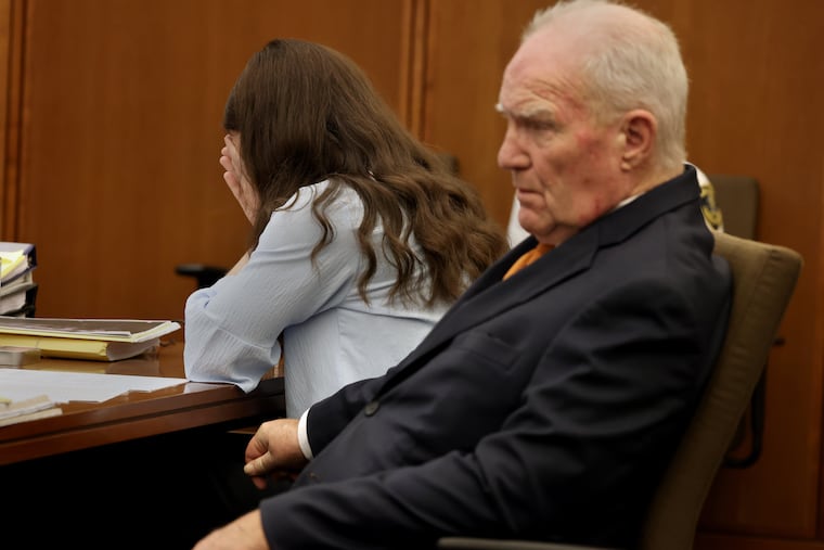 Defense attorney Kevin Reddington and Lindsay Clancy listen to the 911 recording from Jan. 24, 2023, during Clancy's murder trial at Plymouth Superior Court in Plymouth, Mass., on Wednesday.