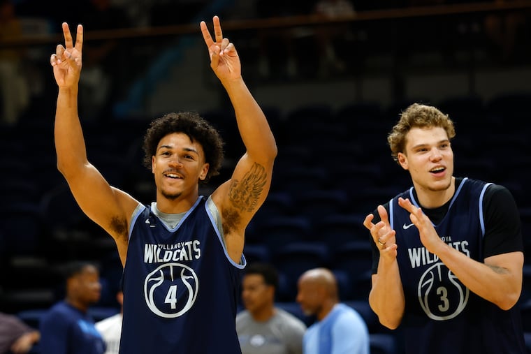 Villanova guard Tyler Perkins (left) during player introductions with teammate forward Matt Hodge during an open practice at Finneran Pavilion on Monday.