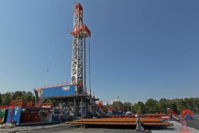 A shale-gas drilling rig in Susquehanna County. Janney analyst Michael Gaugler likes the stocks of three companies backing projected pipelines to bring upstate gas to Philly.