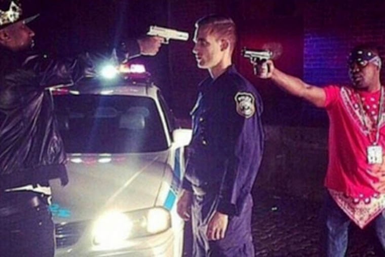 An instagram by @camman_cell, with the caption "Our real enemy...need 2 stop pointing guns at each other & at the ones that's legally killing innocents."