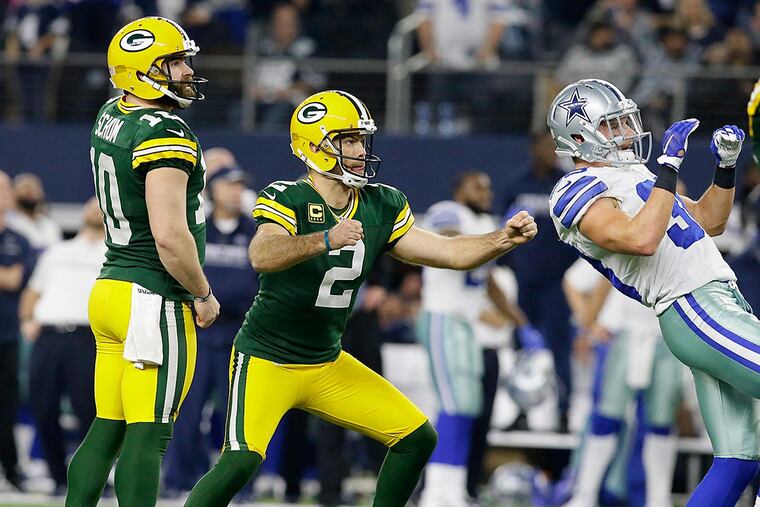 Green Bay Packers kicker Mason Crosby (2) watches his 51-yard field goal to win the game as time expires during the second half of an NFL divisional playoff football game against the Dallas Cowboys Sunday, Jan. 15, 2017, in Arlington, Texas. The Packers won 34-31.
