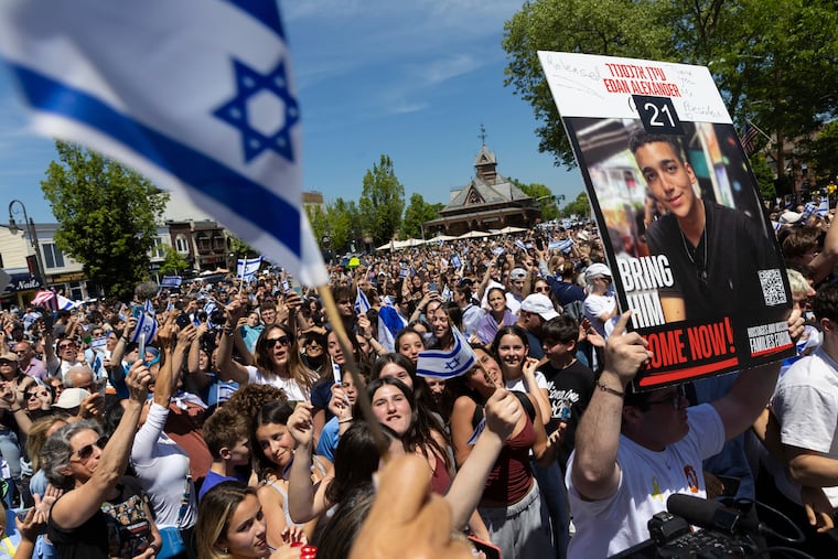 People gathered in Huyler Park celebrate the release of American hostage Edan Alexander from Hamas on Monday.