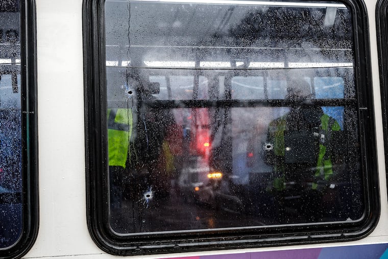 SEPTA investigators take pictures on the bus that has several bullet holes in it that was passing by when the shooting started. Eight juveniles were shot at the corner of Cottman Avenue and Rising Sun Avenue shortly before 3 PM this afternoon over 30 shell casings were found at the scene. Wednesday, March 6, 2024