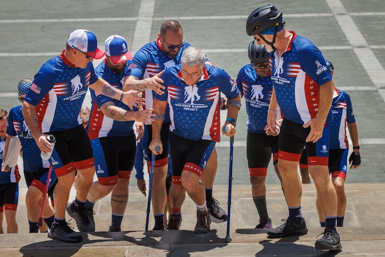 Bruce Cooper, a veteran from both the Army and Air Force, suffered a spinal cord injury during his service in Afghanistan. He is climbing the steps at the Philadelphia Museum of Art. He is from Boise, Idaho.