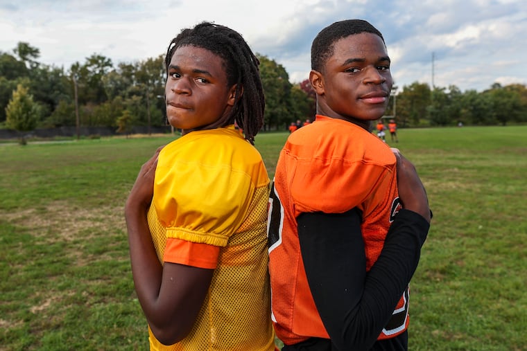 Quarterback Jalen Harris (left) and his twin brother Daron, a defensive back, during practice at Chester High School on Thursday.