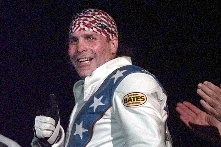 Robbie Knievel gives a thumbs up after jumping a train at the Texas State Railroad Park in Palestine, Texas, in 2000.
