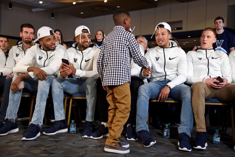 A young fan steps up to shake hands with Villanova’s Jalen Brunson as everyone waits for start of the NCAA Selection Sunday show on campus March 11, 2018.