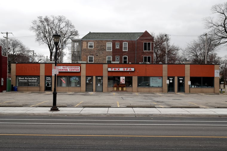 A parking lot in the Village of Oak Park, Ill., sits empty where small businesses are closed, Friday, March 20, 2020. Here are nine steps small businesses can take to save their businesses. (AP Photo/Charles Rex Arbogast)