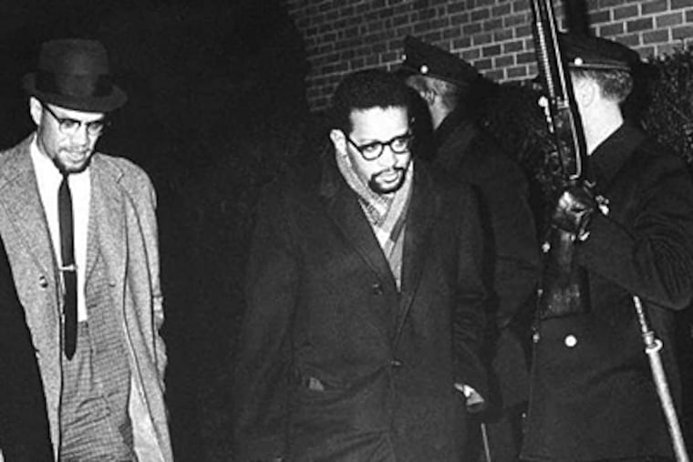 Walking through a row of Philadelphia Police there to protect him, Malcolm X arrived at WDAS studios on the night of Dec. 29, 1964, for one of his last interviews. (UPI TELEPHOTO WIRE SERVICE - WDASHISTORY.ORG)