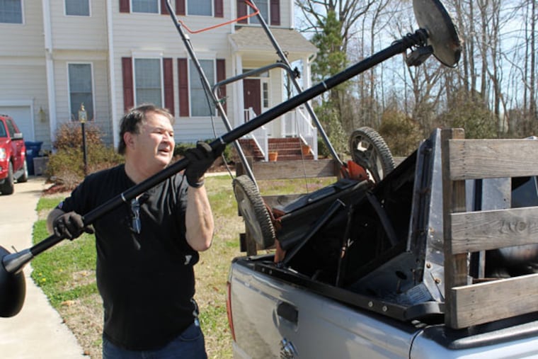 Jim Ridenhour loads a lamp from a neighbor to carry to a recycler in Carrollton, Va., on April 201, 2014. Ridenhour has been earning extra money by scrapping but has found the increase in metal thefts, especially copper wire, makes it harder for legitimate scrappers. (Nicole Paitsel/Newport News Daily Press/MCT)