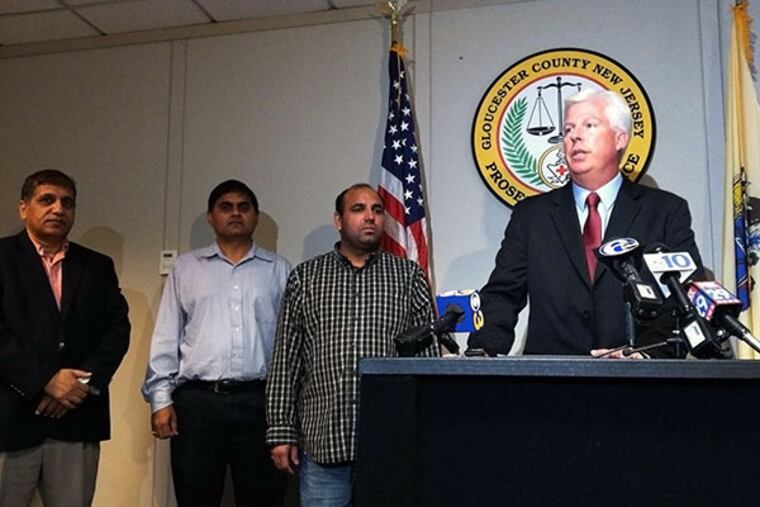 Santinder Singh, brother of the victim, listens as Gloucester County Prosecutor Sean F. Dalton announces arrests in the Sept. 25 fatal shooting of 40-year-old service station attendant Surinder Singh at his work place, Garden State Fuel in Woodbury. ( DAVID M WARREN / Staff Photographer )