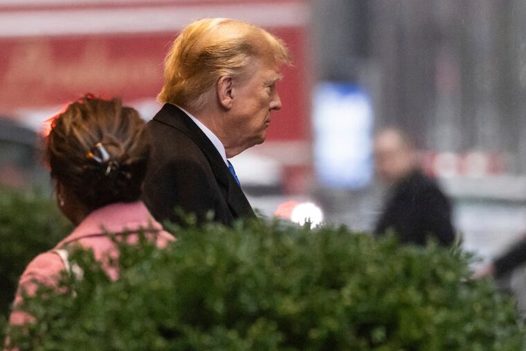 Former President Donald Trump leaves his apartment building on Thursday.