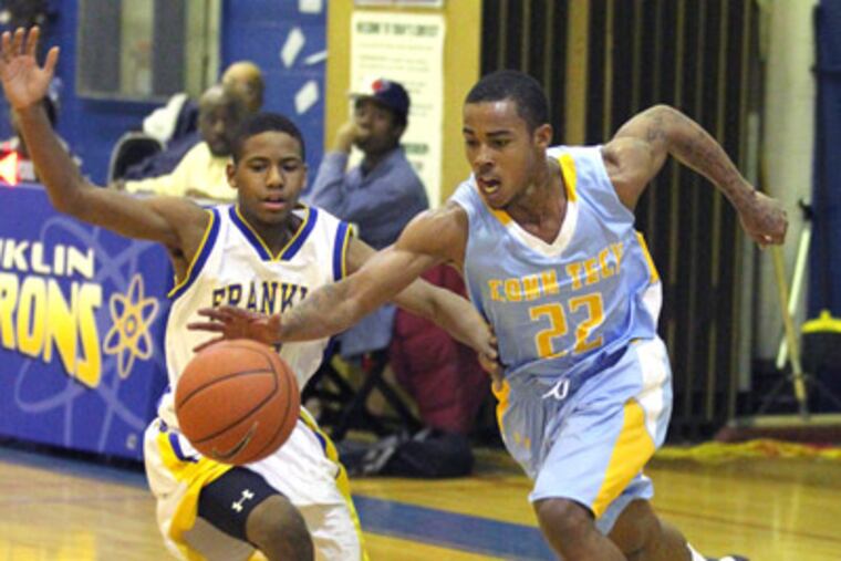 Rich Hopkins, right, of Communications Tech comes up with the ball in front of Kevin Tillery of Ben Franklin after their trapping defense had created a loose ball in the second quarter. NOTE: SPELLINGS ARE NOT CQ. MOST CAME FROM THE SCOREBOOK AND WERE HANDWRITTEN. ( Charles Fox / Staff Photographer ) SBOY20P, 12/19/2011, COMMUNICATIONS TECH AT BEN FRANKLIN HS, Ben Franklin HS, 550 North Broad St., Phila., PA