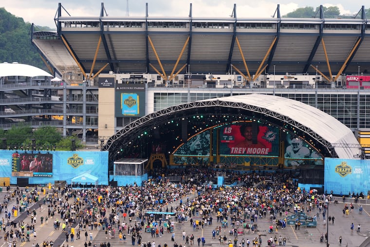 Fans watch at the draft theater during third day of the NFL football draft, Saturday, April 25, 2026, in Pittsburgh. (AP Photo/Gene J. Puskar)
