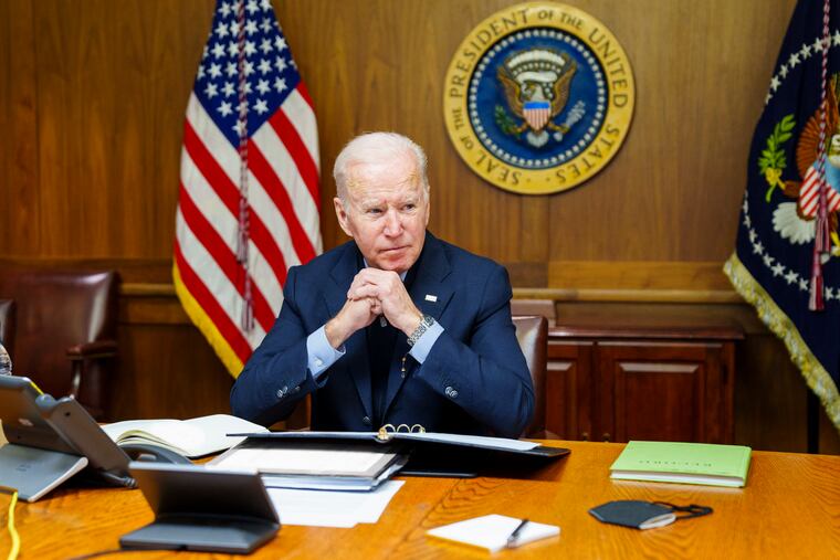 This image provided by The White House via Twitter shows President Joe Biden at Camp David, Md., Saturday, Feb. 12, 2022. Biden on Saturday again called on President Vladimir Putin to pull back more than 100,000 Russian troops massed near Ukraine’s borders and warned that the U.S. and its allies would “respond decisively and impose swift and severe costs” if Russia invades, according to the White House.