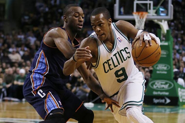 Rajon Rondo scored 17 points with 12 assists and 10 rebounds on Monday night to lead the Boston Celtics to a 100-89 victory over the Charlotte Bobcats. (Charles Krupa/AP)