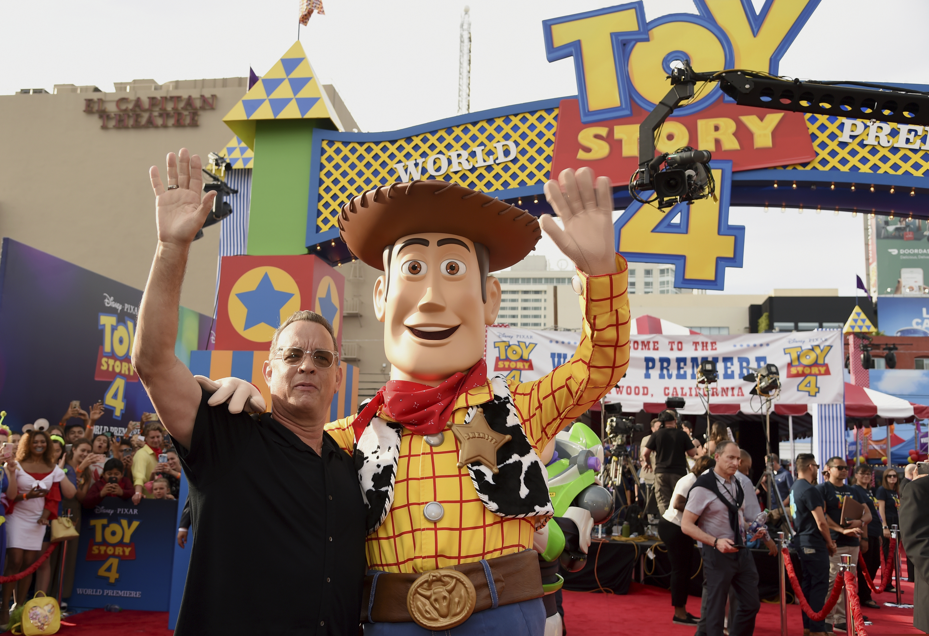 Tom Hanks, left, poses with his character Woody as he arrives at the world premiere of "Toy Story 4" on Tuesday, June 11, 2019, at the El Capitan in Los Angeles. (Photo by Chris Pizzello/Invision/AP)