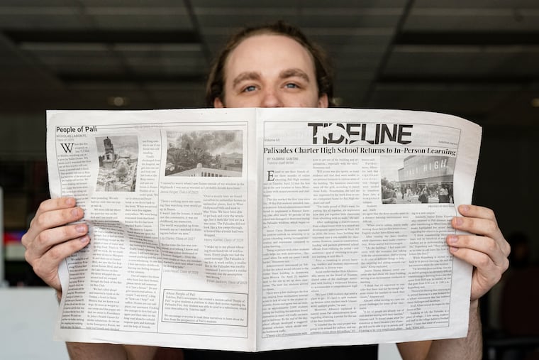 Samuel O'Neal, Temple News EIC, holds a copy of the Temple News paper at Temple University in Philadelphia, April 29, 2025. Temple News is publishing a section of its final paper of the year which features reporting, essays and more from high school and middle schoolers affected by the California wildfires.