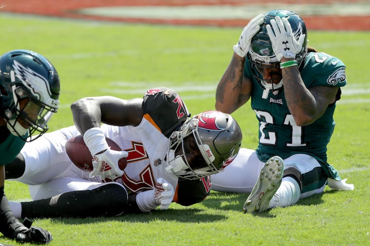 Ronald Darby (right) reacts after Chris Godwin catches a pass for a first down right in front of him.