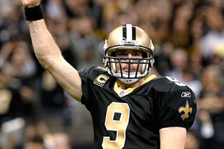 Quarterback Drew Brees set a record for most passing yards in a season last year. (Rusty Costanza/AP)