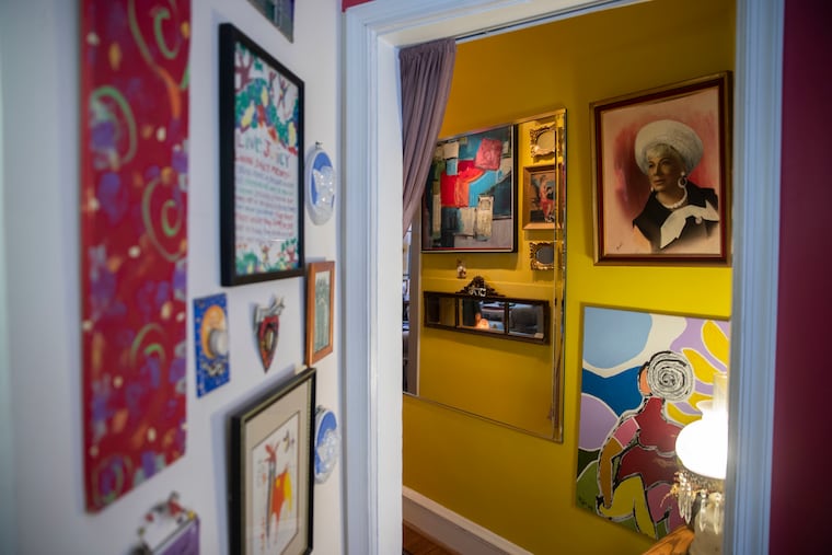 A homeowner in Ardmore placed mirrors throughout her apartment to reflect light and give the illusion of space. From a long mirror in the hall, she can see both her back and front doors.