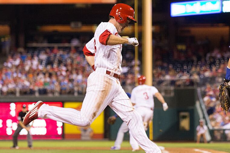 Philadelphia Phillies second baseman Chase Utley (26) scores during the fifth inning against the Toronto Blue Jays at Citizens Bank Park.