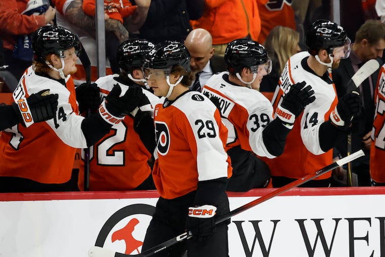 Flyers' Nikita Grebenkin celebrates his second period goal with his teammates against the Vancouver Canucks on Monday.
