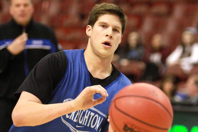 Creighton Bluejays' coach Greg McDermot watches his son (3) Doug McDermott warm up at the Wells Fargo Center in advance of the second round of the NCAA tournament March 21, 2013. ( DAVID SWANSON / Staff Photographer )
