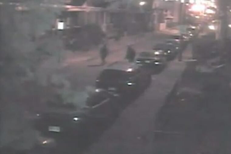 Two suspects seen walking down the street that are wanted for their involvement in slashing 56 tires overnight in West Philadelphia, police said.