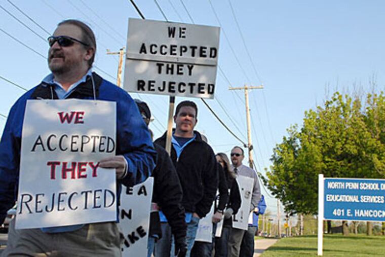 Striking teachers from the North Penn Education Association picket outside the North Penn School District administration building in Lansdale. (Tom Gralish / Staff Photographer)