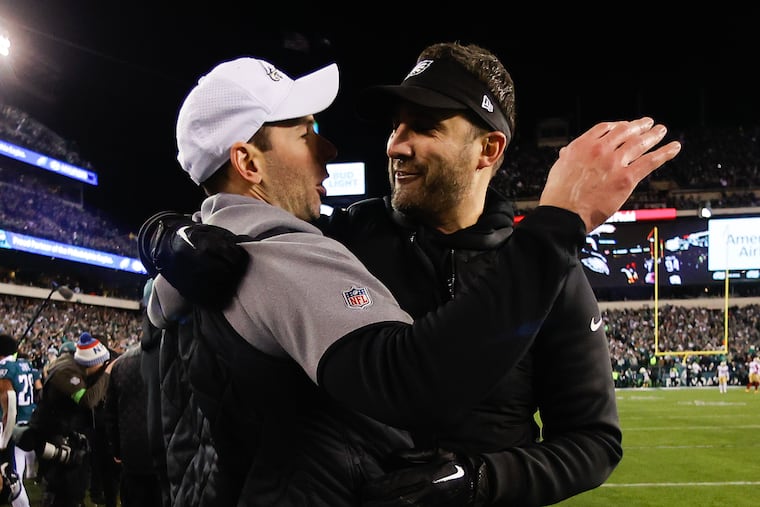 Eagles coach Nick Sirianni and former defensive coordinator Johnathan Gannon embrace late in the game against the San Francisco 49ers for the NFC Championship title on Jan. 29.