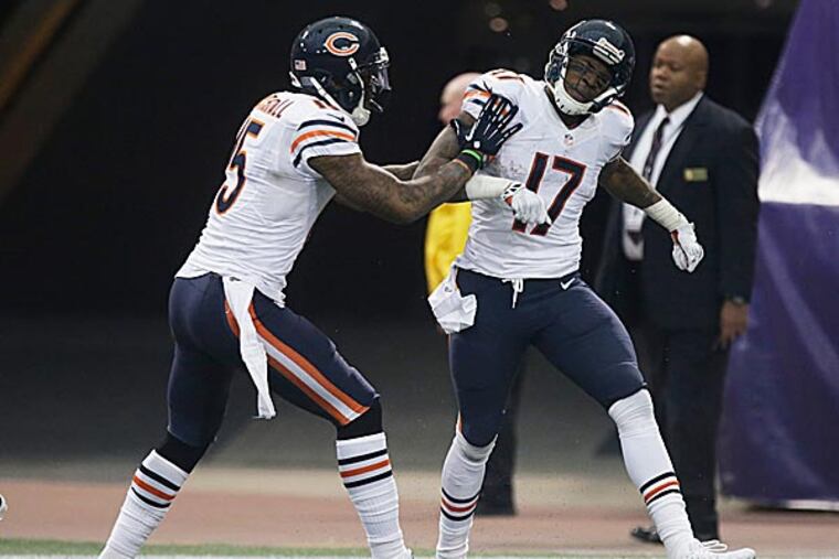 Bears wide receiver Alshon Jeffery celebrates with teammate Brandon Marshall. (Ann Heisenfelt/AP)