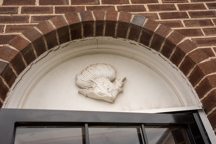 An engraving above the door of Thompson's home.