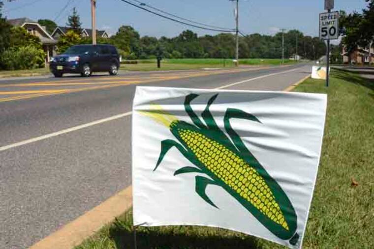 A sign along Chapel Heights Rd. in Sewell advertises Duffield’s Farm Market July 29, 2013, where they boast, "The Duffield Family raises over 50 varieties of vegetables and fruits, including peaches, strawberries, nectarines, and the BEST sweet corn and tomatoes in South Jersey!" New Jersey Secretary of Agriculture Douglas H. Fisher stopped by the farm on a tour of three southern counties to highlight where consumers can find Jersey Fresh produce during this prime time of growing season. ( TOM GRALISH / Staff Photographer )