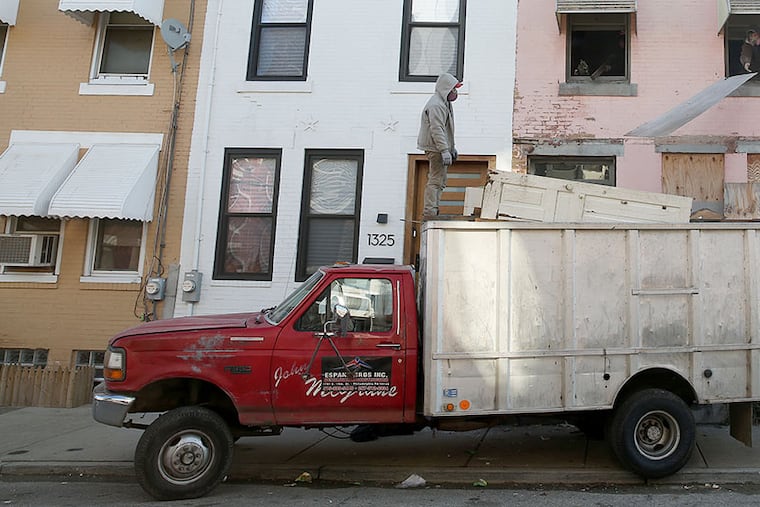 On the 1300 block of North 27th Street in Philadelphia's Brewerytown neighborhood, an older, deteriorating home is next to newer development. Many neighborhoods like this in the city often experience the growing pains associated with gentrification.