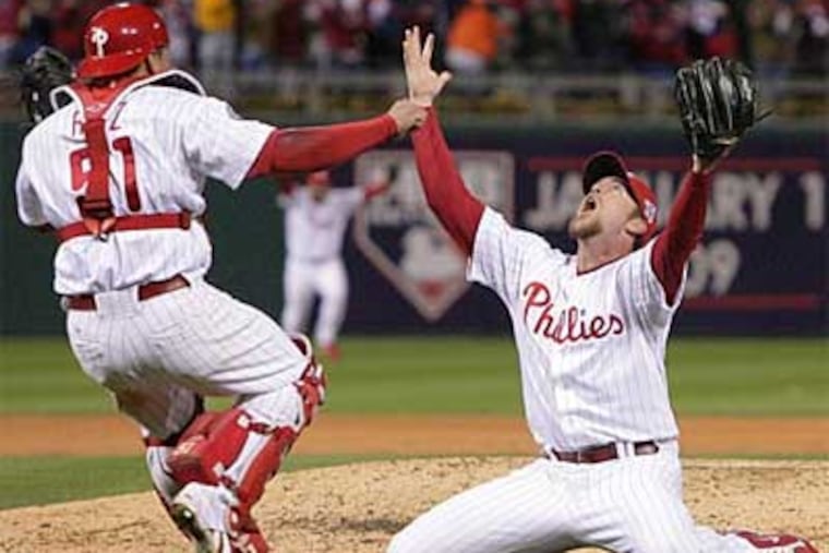 Closer Brad Lidge drops to his knees and waits for catcher Carlos Ruiz after the Phillies won the 2008 World Series. That game is part of Mike Rodgers' YouTube collection.