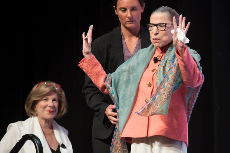 Supreme Court Associate Justice Ruth Bader Ginsburg waves to the audience at the Library of Congress National Book Festival in Washington in August.