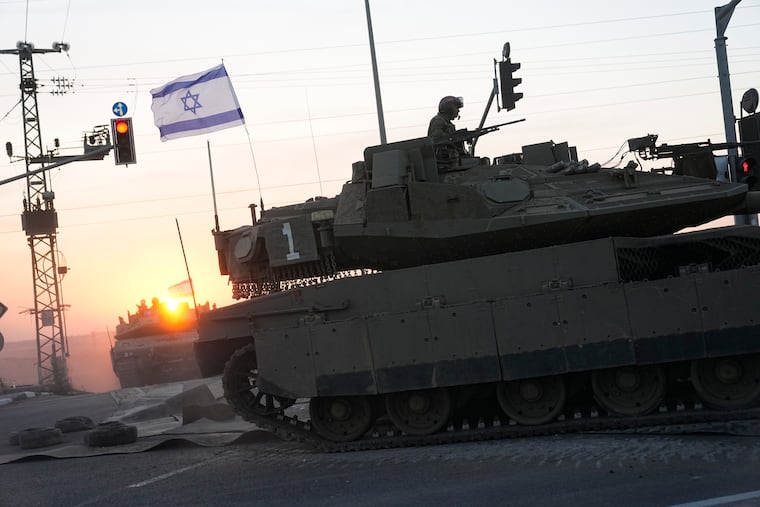 Israeli tanks head toward the Gaza Strip border in southern Israel on Thursday.