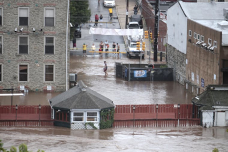 Manayunk took a beating from Hurricane Irene, with severe flooding in the predictable locations last Aug. 28. The month set a rainfall record. (David Swanson / Staff Photographer)