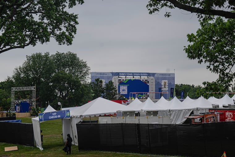 Crew members make final preparations, including work on a 60-foot-wide screen, for FIFA Fan Festival at Lemon Hill in Philadelphia on Tuesday, June 10, 2026. The festival will include cooling stations to protect visitors from extreme heat expected Thursday and Friday.