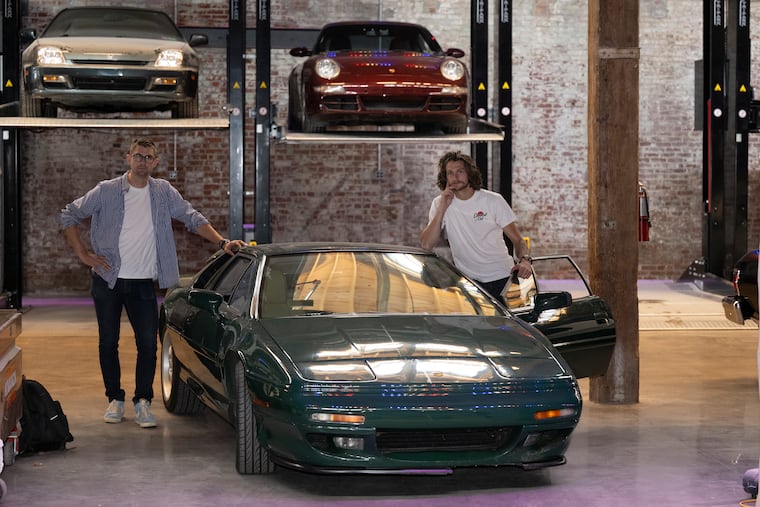 Owner Chris Allen (left) and Cannonball partner James Allen inside the Cannonball Club in Fishtown. The club will offer a space where members can eat, drink, and socialize among vintage and collectible vehicles.