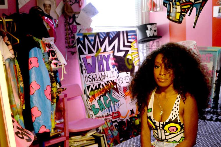 Mount Airy artist Iris Barbee Bonner in her bedroom/studio. The slurs she paints on her line, Thesepinklips, raise bias awareness. "My clothes are for the fearless." TOM GRALISH / Staff Photographer