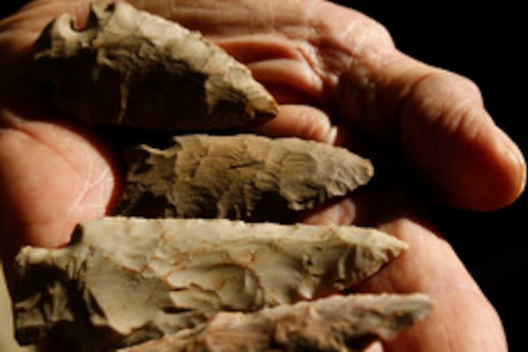 "I'd say we've just scratched the surface of what's here," said the Rev. James Clark, left, whose family has been in the area for generations.At right, he holds some of the arrowheads he has found on his property.
