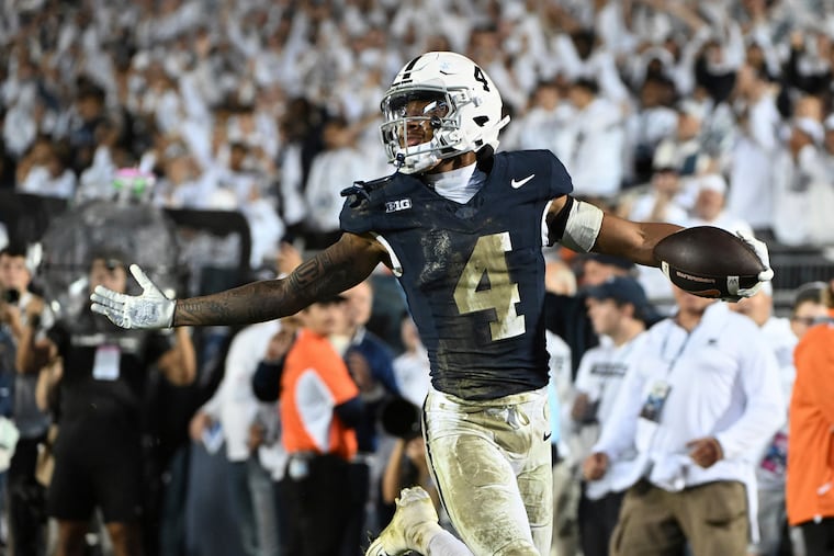Penn State cornerback A.J. Harris (4) celebrates an interception against Illinois during the fourth quarter on Sept. 28.