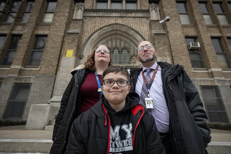 Samuel and Michelle Riccobono pose for a photo with their son, Joseph, a sixth-grader, on Monday, March 2, 2026, near AMY Northwest Middle School in Philadelphia.