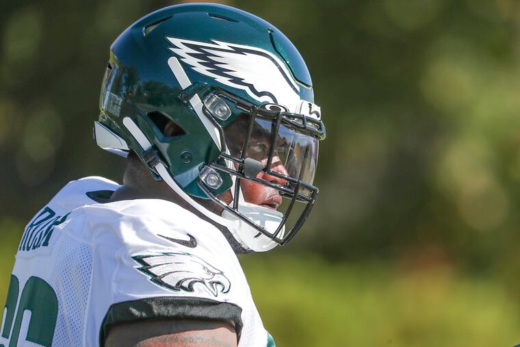 Eagles defensive tackle Anthony Rush, whom the Eagles signed off of the Oakland Raiders' practice squad earlier this week, does stretches during his first day of practice at the NovaCare Complex.